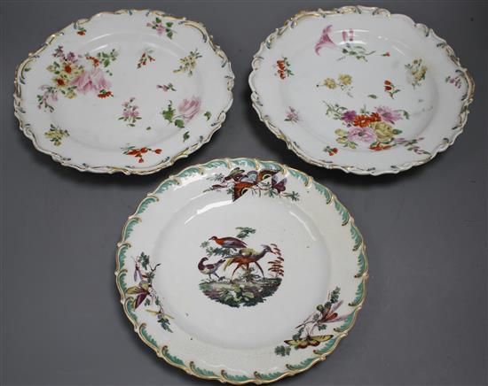 A Chelsea gold anchor bird and insect plate and a similar pair of floral plates, c. 1765, 22 and 23cm